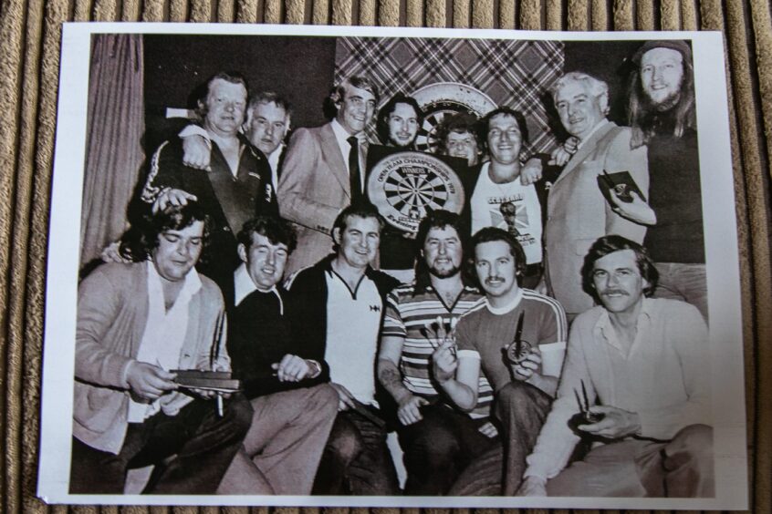 Jocky and his friends celebrate after winning the Evening News with the Alpha Bar in 1978.