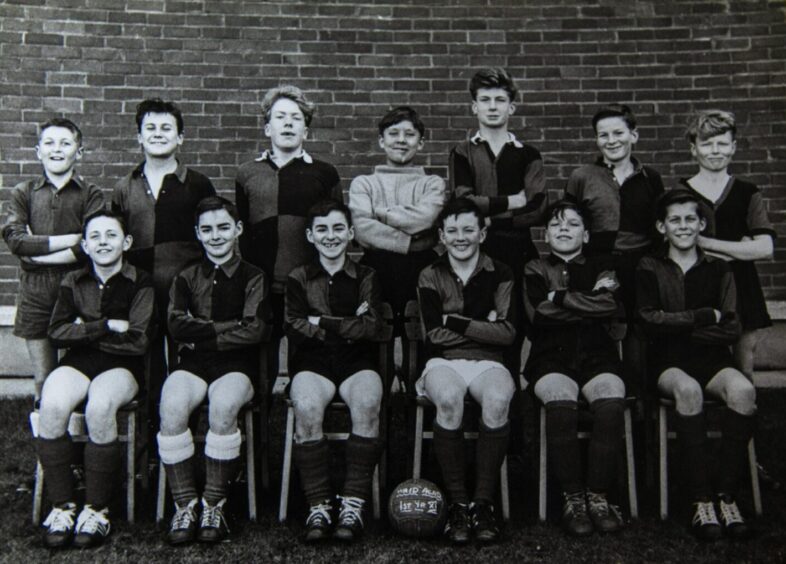 Jocky and his Waid Academy football team-mates