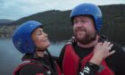 Judith Ralston and Grado got a bit wet while paddleboarding in Loch Tay. Image: BBC Scotland