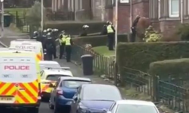 Police in riot gear entering the building. Image: Supplied