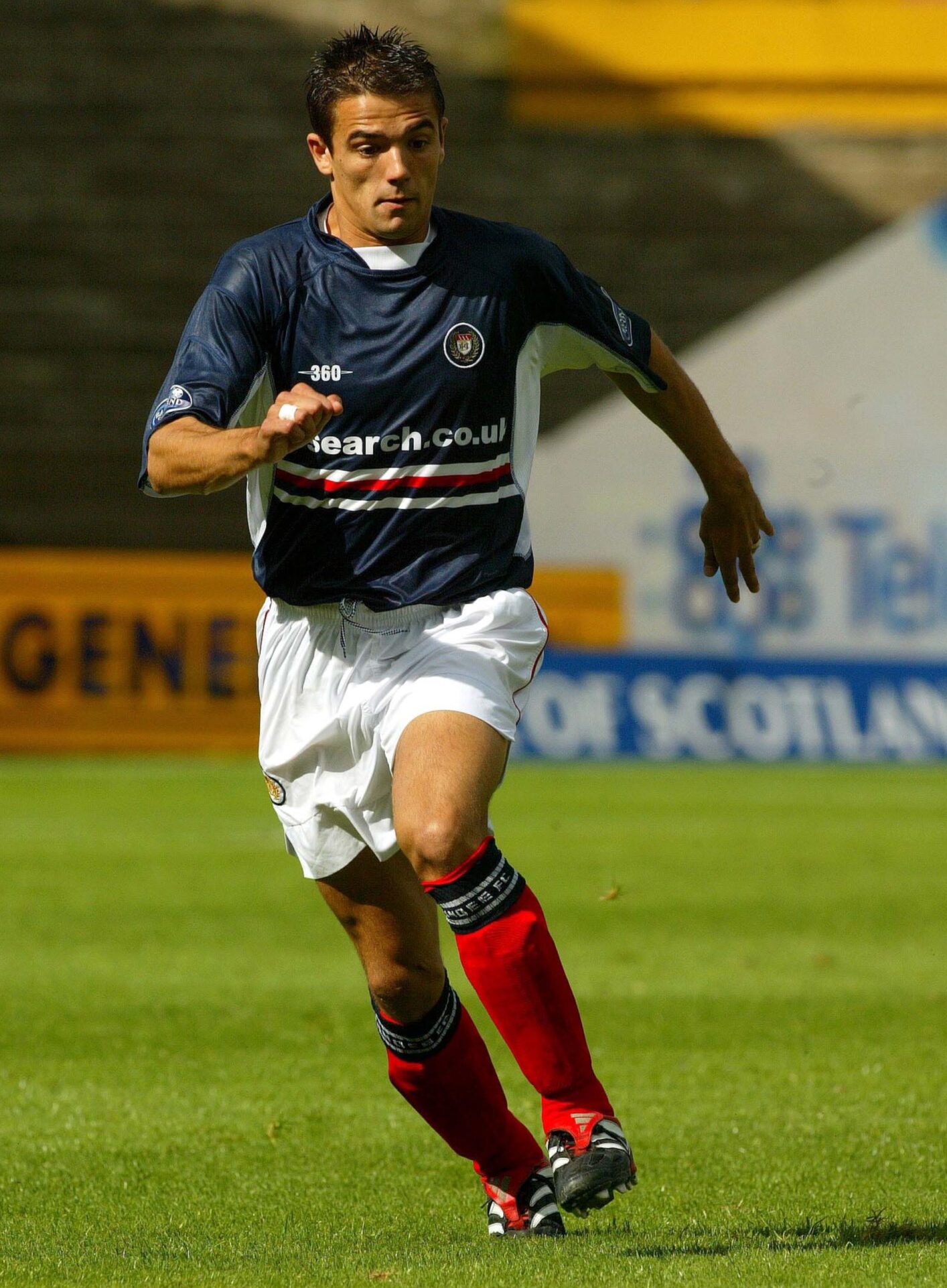 Nacho Novo runs while playing for Dundee FC