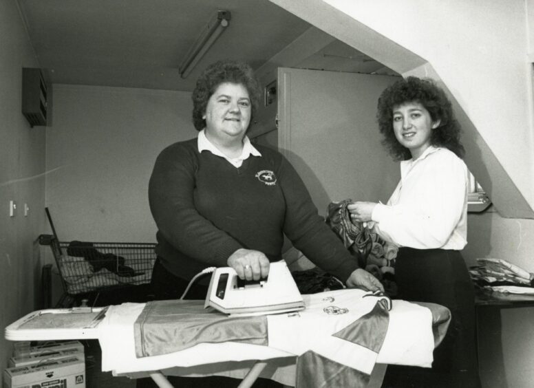 Agnes Moffat ironing a St Johnstone top in the Muirton Park laundry room.