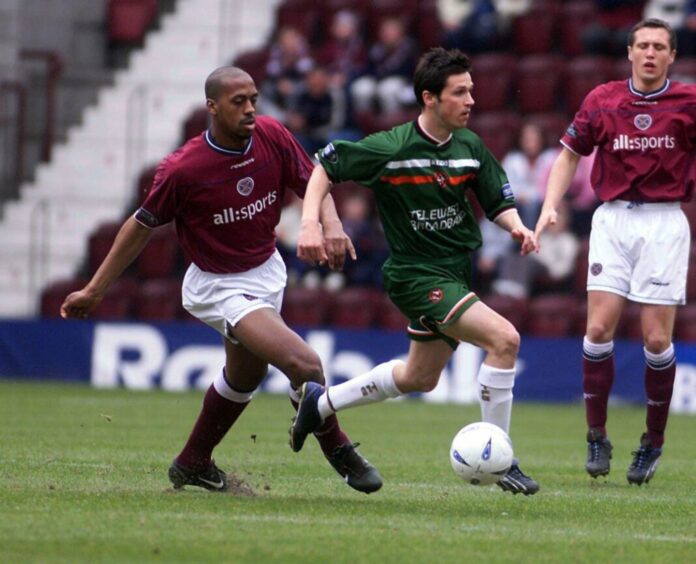 Craig Easton playing for Dundee United against Hearts in the green Telewest shirt in 2003