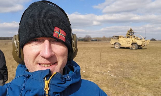 Courier senior writer Michael Alexander watches a Royal Scots Dragoon Guards live firing demonstration at Babadag, Romania. Image: Michael Alexander