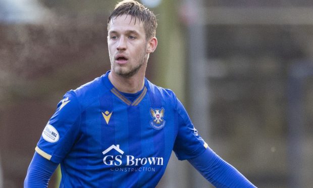 Daniels Balodis in action for St Johnstone at Dundee.