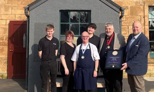 The Inn at Kingsbarns team celebrate receive their award.