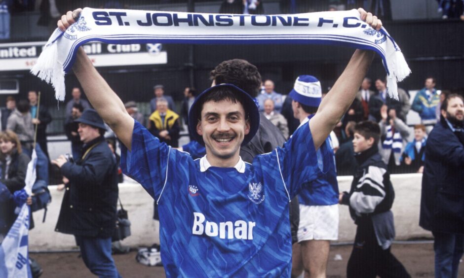 St Johnstone great Steve Maskrey in the Bonar shirt and holding a Saints scarf above his head after winning promotion to the Scottish Premier Division.