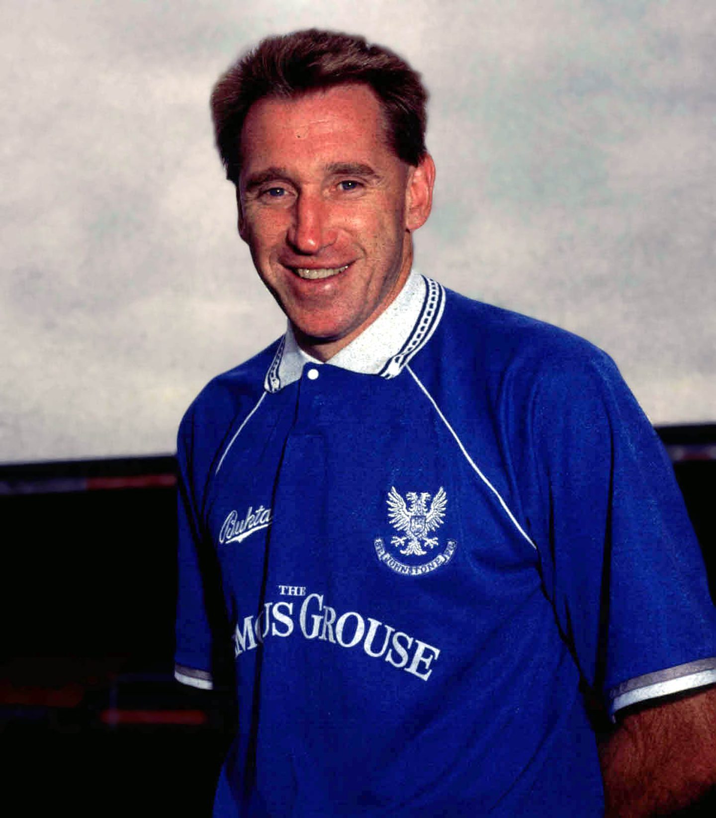 St Johnstone player John McClelland poses for a picture in the Perth club's kit on the pitch in 1992.