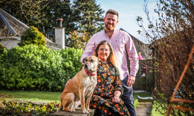 CR0052123, Rebecca Baird, Monikie, Barry Watkins, his wife Victoria for a magazine feature at their home. The family moved to Monikie from Essex after featuring on Escape to the Country.. Picture shows; Barry and Victoria Watkins at home in Monikie with their dog Chica. Tuesday 25th February, 2025. Image: Mhairi Edwards/DC Thomson