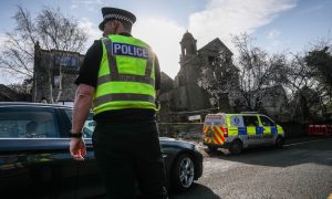 Police outside Maison Dieu Church in Brechin following the fire. Image: Mhairi Edwards/DC Thomson