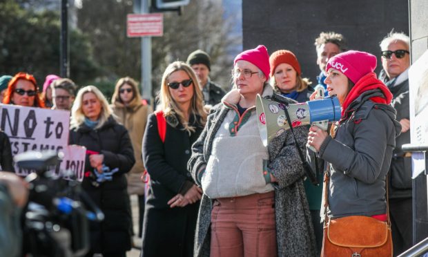 Staff gather outside the Dalhousie building after the news breaks. Image: Mhairi Edwards/DC Thomson.