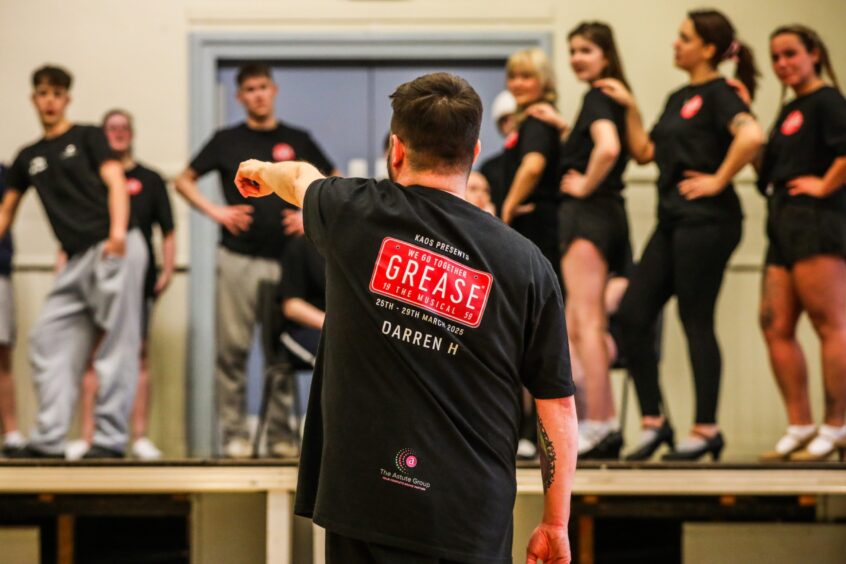 Choreographer director Kirriemuir Amateur Operatic rehearsals of Grease.