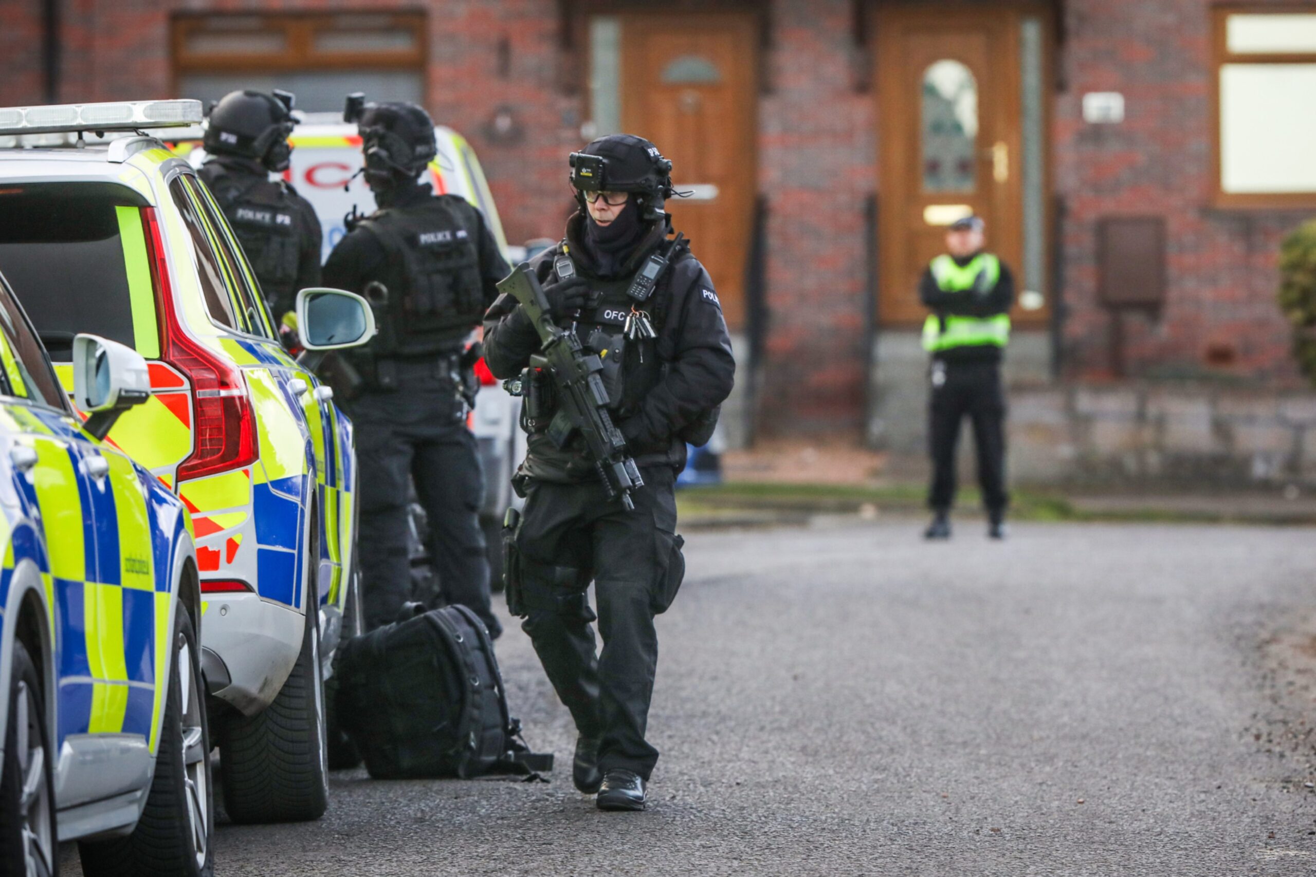 Armed officers at the scene.