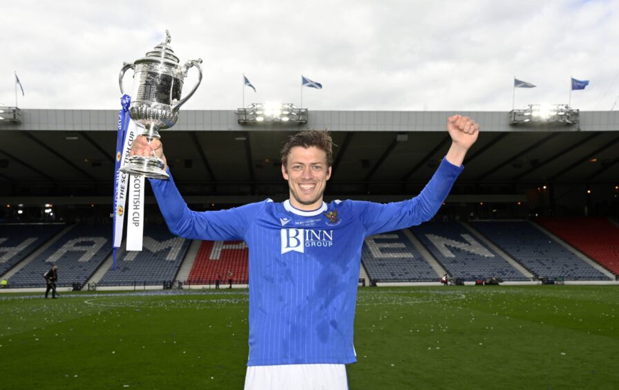 Murray Davidson on the Hampden Park pitch with the Scottish Cup. 