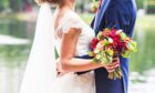 married couple with bouquet