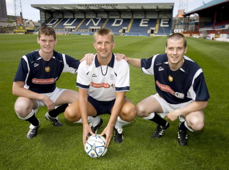 Gary McKenzie, Bobby Mann and Danny Griffin pose for a picture at Dens Park in the new Dundee FC kit 