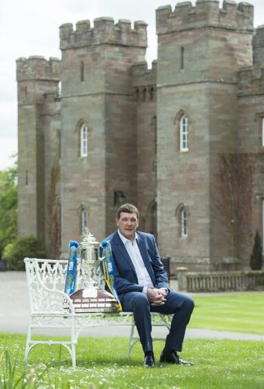 Tommy Wright with the Scottish Cup trophy at Scone Palace.