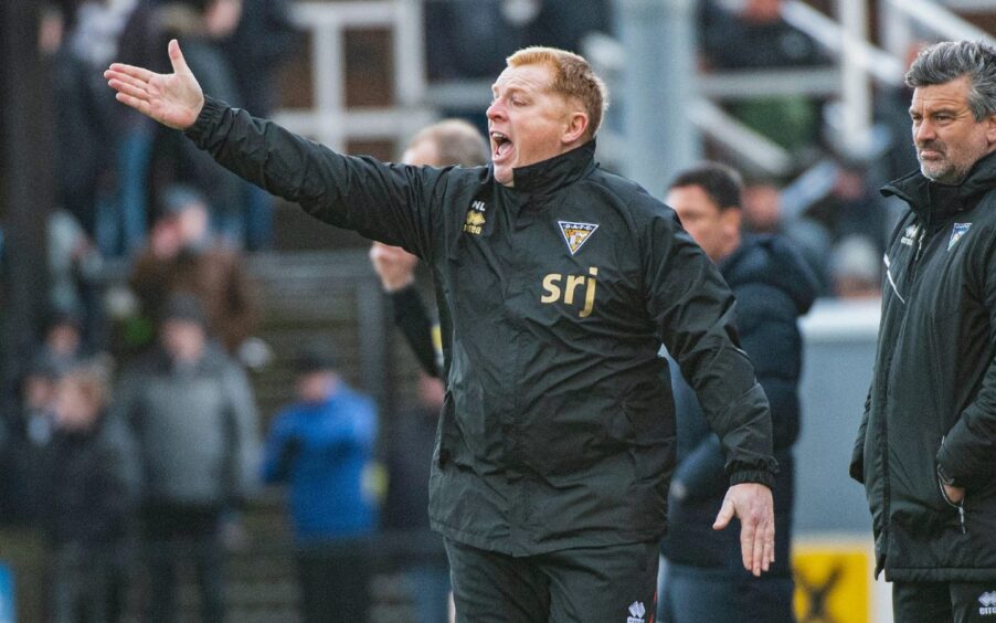 Neil Lennon shouts and waves his right arm as he tries to organise Dunfermline from the touchline.