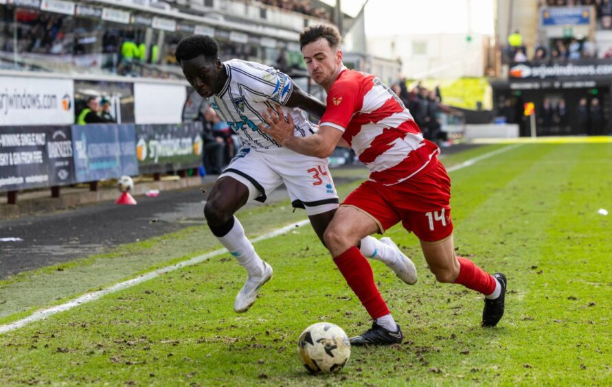 Ephraim Yeboah appears to be pushed off the ball by Hamilton Accies defender Barry Maguire.