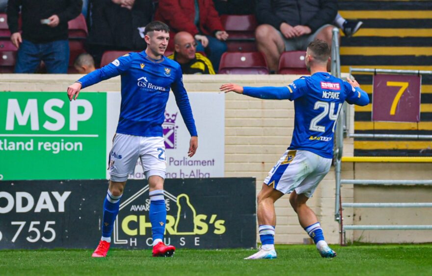 Makenzie Kirk celebrates with Josh McPake after scoring against Motherwell.