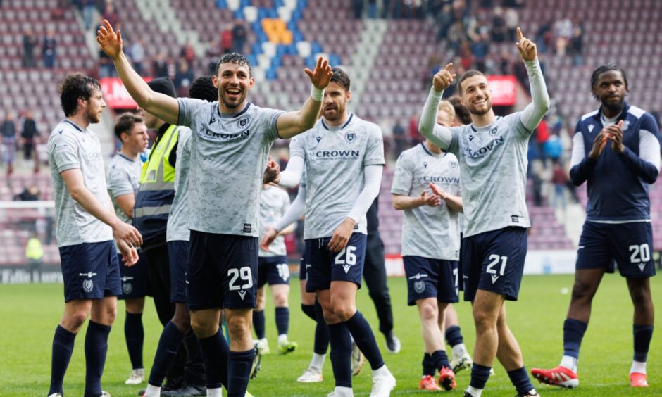 Dundee players enjoy the victory. Image: Ross Parker/SNS