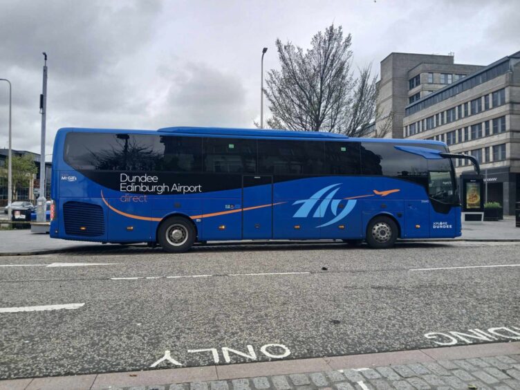 An Xplore Dundee Fly bus parked in the City of Discovery. 