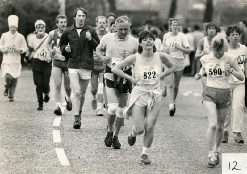 A busy scene showing lots of runners