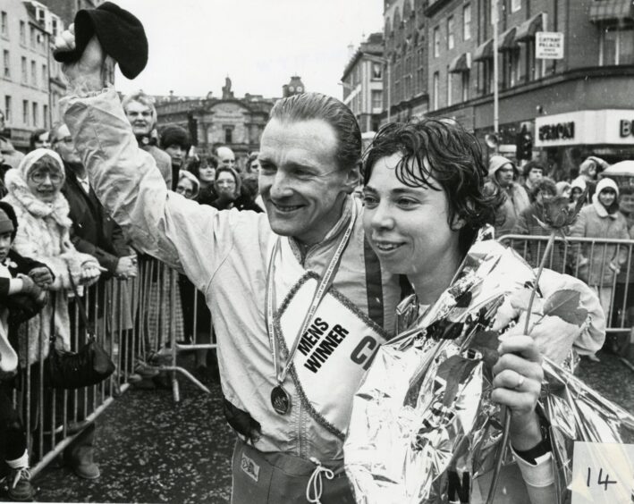 Smiling Murray McNaught and Ann Curtis greet the crowd.