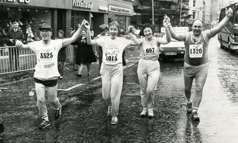 The last four official finishers in the Dundee Marathon. Image: DC Thomson.