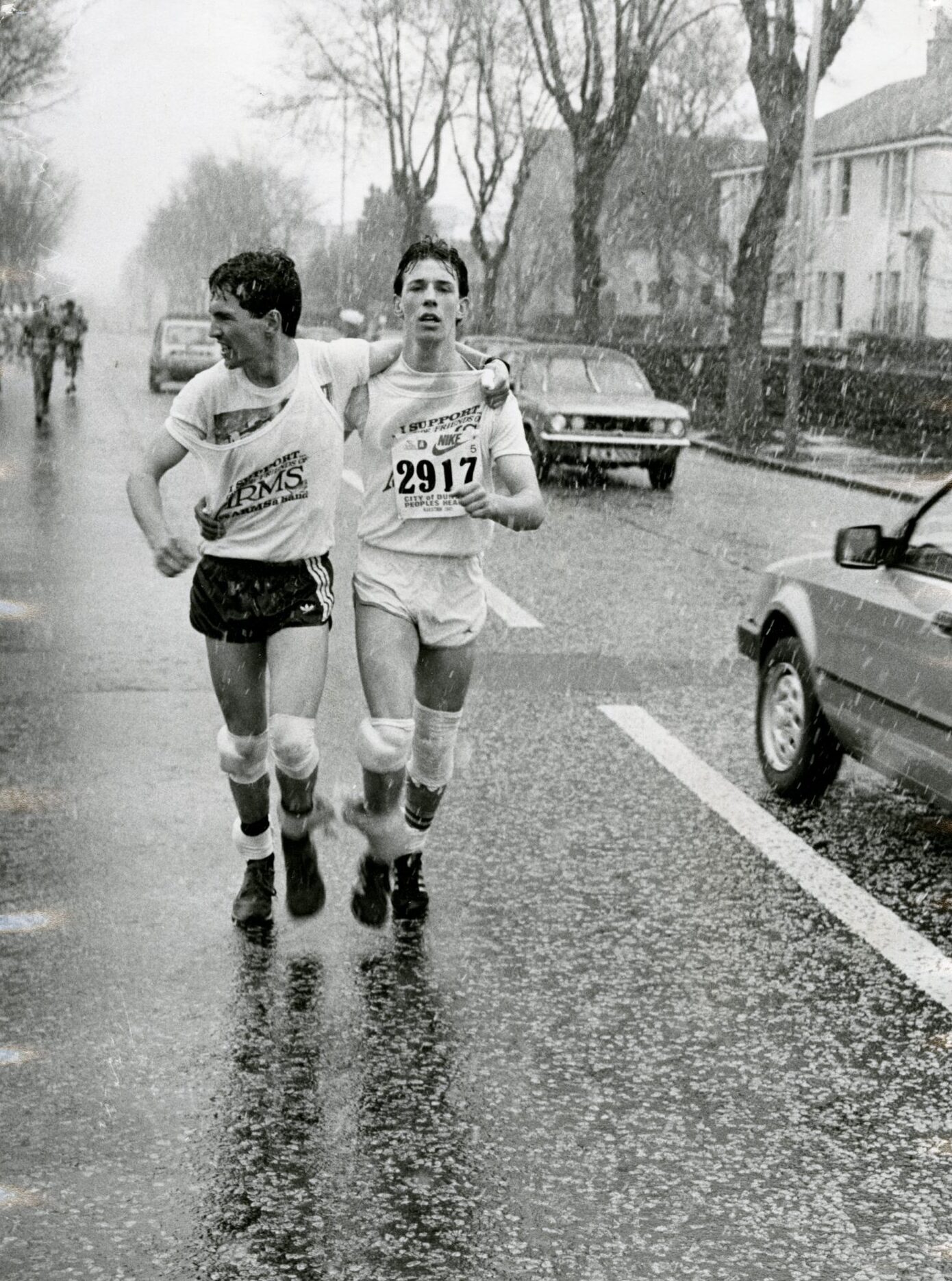 Two men run the marathon three-legged-runners