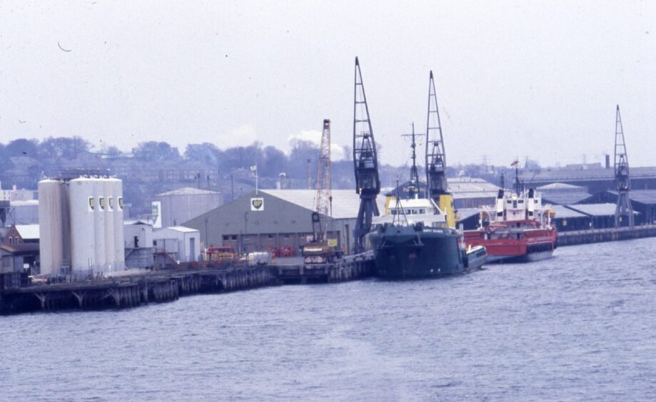 two large ships are lined up along the dock in this shot of Dundee Harbour in 1987.