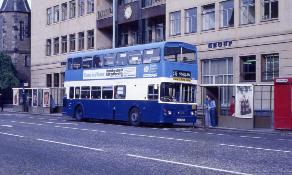 A bus stopped outside the Royal Exchange Assurance Building in Albert Square, Dundee, in 1987.