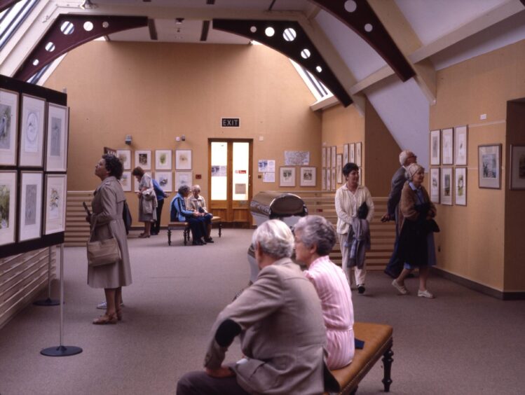 Visitors were checking out some of the paintings on display in McManus Galleries.