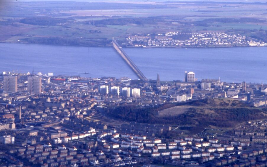 Aerial view showing Dundee, the Tay Road Bridge and Fife coastline.