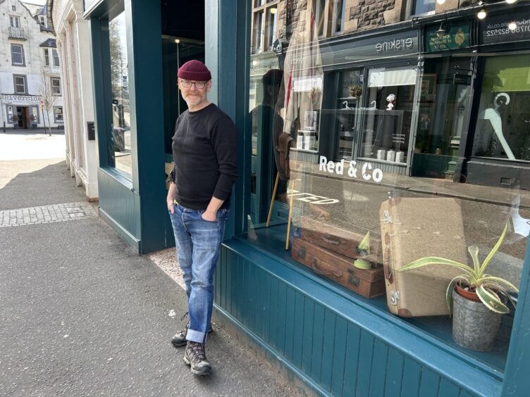 Ed standing outside his barber shop on Dunblane High Street