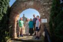 Remeny Royle with her sons, Alex and Luke,  mother Flavia Guthrie-Armitage and the Rev. Brian Ramsay at Guthrie Church. Image: Kim Cessford/DC Thomson