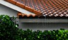 Roof with rain pouring off
