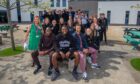 Mo Sylla, Billy Koumetio and Ziyad Larkeche with teachers Katherine Irvine (left), Hope Gaffney (back right) and Carnoustie High youngsters. Image: Steve MacDougall/DC Thomson