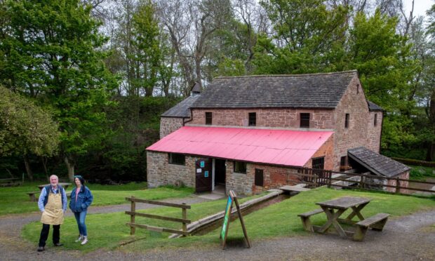 NTS visitor services supervisor Mike Metcalfe and Gayle Ritchie at newly renovated Barry Mill.