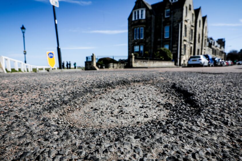 A large pothole on Gibson Place in St Andrews. 