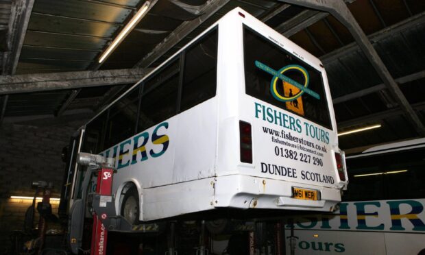 A Fishers Tours bus on a service ramp in Mid Craigie. Image: DC Thomson.