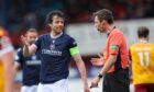 Joe Shaughnessy questions referee Kevin Clancy in Dundee's home defeat to Motherwell. Image: Robert Perry/Shutterstock