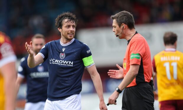 Joe Shaughnessy questions referee Kevin Clancy in Dundee's home defeat to Motherwell. Image: Robert Perry/Shutterstock