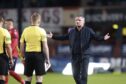 Tony Docherty meets the referee team after the final whistle. Image: David Young/Action Plus/Shutterstock
