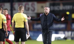 Tony Docherty meets the referee team after the final whistle. Image: David Young/Action Plus/Shutterstock