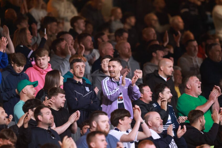 Dundee fans gave Lyall Cameron a fitting send-off at Dens Park. Image: David Young/Action Plus/Shutterstock
