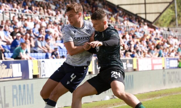 Josh McPake battles with Ryan Astley for the ball.