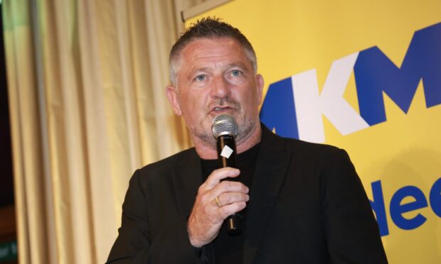 Tony Docherty addresses Dundee fans and players at the Player of the Year event on Sunday evening. Image: David Young