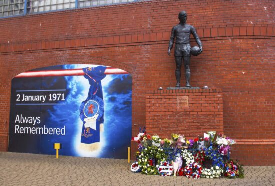 Tributes at the John Greig statue in memory of the 66 fans who lost their lives in the Ibrox disaster, 1971.