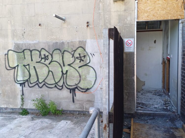 Graffiti on the Stirling building's walls